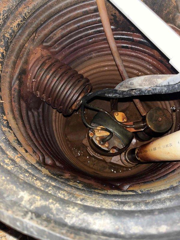 Completed comprehensive BFMA tune-up on 6+ year old air conditioning system following previous no-cool service calls. Performed standard maintenance protocol including inspection of air handler unit with heat exchanger coils, replaced air filter, and evaluated system components. Inspected sump pump assembly in mechanical room, noting visible corrosion and rust on basin and spring coil requiring monitoring for future maintenance considerations.