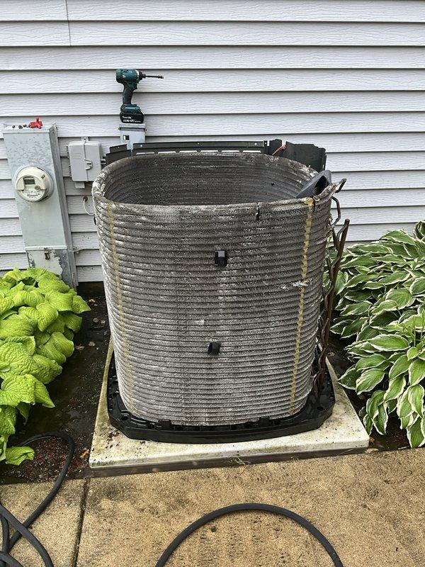 Completed comprehensive BFMA tune-up service on 18+ year old air conditioning system. Performed thorough cleaning of heavily soiled condenser coils which had accumulated significant dirt, dust, and organic debris buildup on exterior fins and heat exchange surfaces. Inspected and serviced outdoor fan motor assembly, addressing accumulated grime on motor housing, top plate, and blade mounting components to restore optimal airflow and system efficiency.