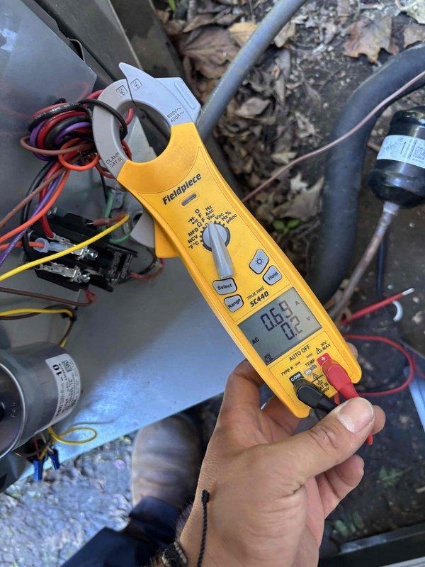 Replaced two AC disconnect switches at the outdoor unit location. Performed electrical testing with clamp meter to verify proper system operation and confirm zero amperage draw during disconnect replacement. Installation included proper conduit routing and weatherproof enclosures mounted to exterior wall, with all electrical connections secured according to code requirements.