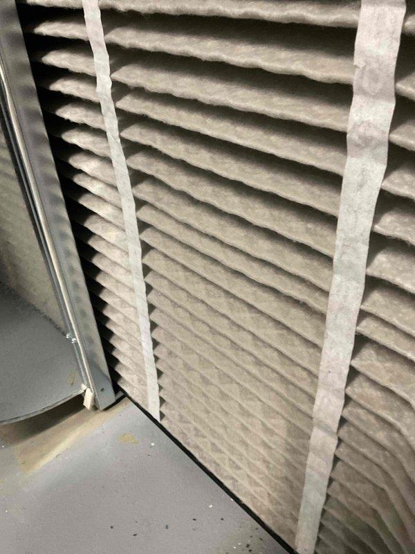Completed comprehensive BFMA tune-up service on dual air conditioning system. Performed full system inspection and maintenance on both AC units, including checking refrigerant levels, electrical connections, and thermostat operation. Inspected air filter showing moderate dust accumulation and examined outdoor condenser unit with heavily soiled coil fins exhibiting significant dirt and debris buildup from extended outdoor exposure. Cleaned condenser coils to restore proper airflow and heat transfer efficiency. Verified all components operating within manufacturer specifications upon completion of tune-up procedures.