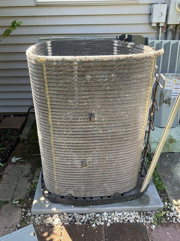 Completed comprehensive BFMA tune-up service on dual air conditioning system. Performed full system inspection and maintenance on both AC units, including checking refrigerant levels, electrical connections, and thermostat operation. Inspected air filter showing moderate dust accumulation and examined outdoor condenser unit with heavily soiled coil fins exhibiting significant dirt and debris buildup from extended outdoor exposure. Cleaned condenser coils to restore proper airflow and heat transfer efficiency. Verified all components operating within manufacturer specifications upon completion of tune-up procedures.