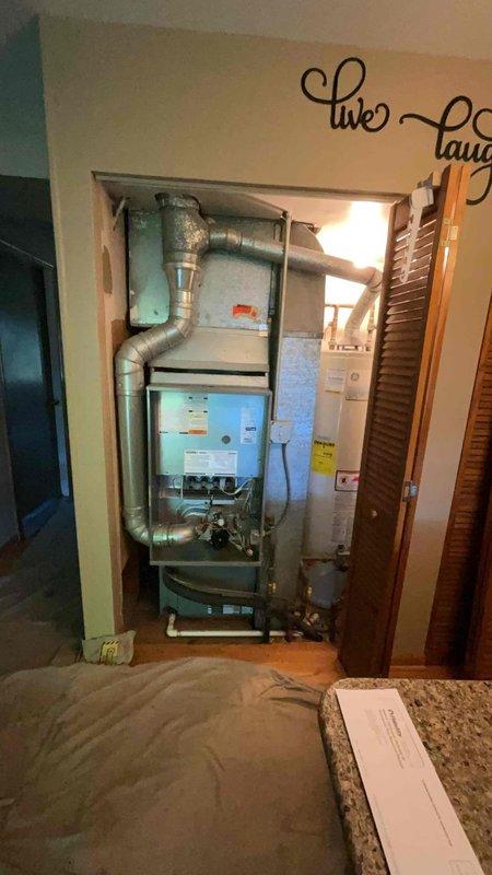 Completed full HVAC system installation in residential bedroom closet space, including Lennox SL280DF090V48BK downflow gas furnace (90,000 BTU), EL15KC1-036-230 air conditioning condenser (3-ton, 15 SEER), and CK40DT-30/36B-71 evaporator coil. Installed all supply and return ductwork with proper insulation, configured downflow setup to accommodate existing closet configuration adjacent to water heater. Ran refrigerant lines between indoor and outdoor units, evacuated system, and charged to manufacturer specifications. Installed P200 thermostat and AA1410 accessories. Completed all electrical connections, tested furnace ignition sequence and heat output, verified airflow across evaporator coil, and confirmed proper condensate drainage. System commissioned successfully with all safety controls operational and performance parameters meeting Lennox specifications.
