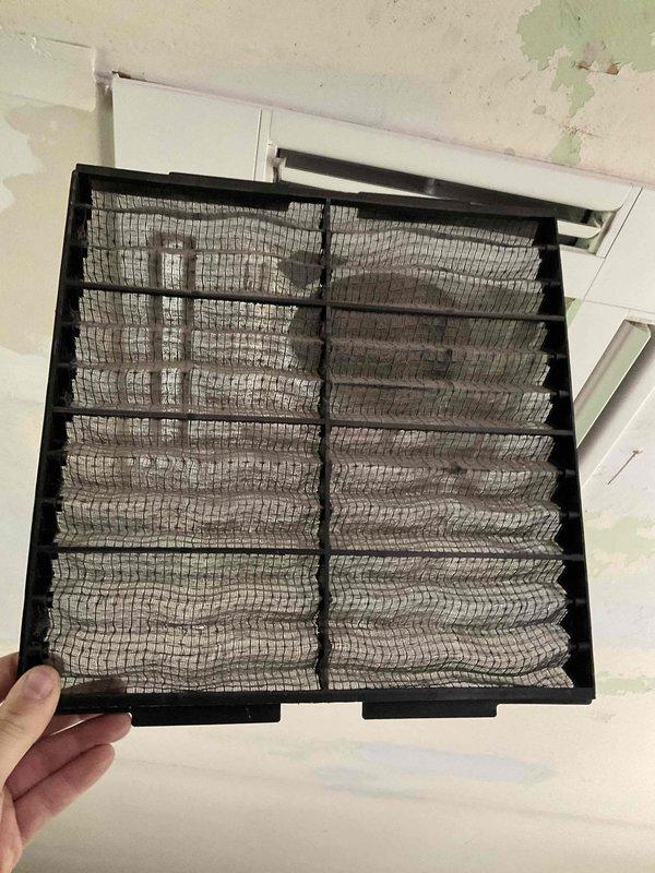 Completed comprehensive BFMA tune-up on 9+ year old Mitsubishi Electric mini-split system. Serviced indoor air handler unit by removing and cleaning heavily clogged air filter that had accumulated significant dust and debris buildup, restricting airflow. Inspected outdoor condenser unit mounted on exterior metal bracket, verified proper operation of dual-fan system, and checked refrigerant lines, electrical connections, and drainage components for proper function.