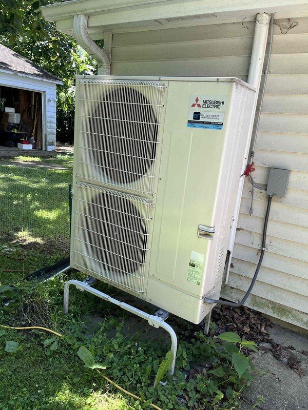 Completed comprehensive BFMA tune-up on 9+ year old Mitsubishi Electric mini-split system. Serviced indoor air handler unit by removing and cleaning heavily clogged air filter that had accumulated significant dust and debris buildup, restricting airflow. Inspected outdoor condenser unit mounted on exterior metal bracket, verified proper operation of dual-fan system, and checked refrigerant lines, electrical connections, and drainage components for proper function.
