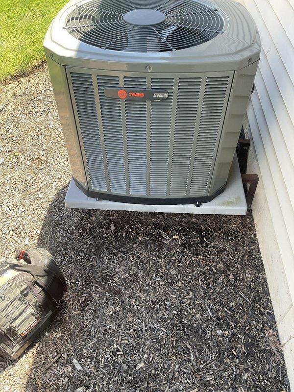 Completed non-member AC tune-up on a 5+ year old Trane residential air conditioning system. Performed comprehensive maintenance inspection including evaluation of outdoor condensing unit and indoor evaporator coil assembly. Evaporator coils showed significant accumulation of dirt and debris on fins, indicating need for cleaning to maintain optimal heat transfer efficiency. Outdoor unit positioned on concrete pad appeared in good overall condition with no visible damage or deterioration. Discussed air filtration options with homeowner to address system performance and indoor air quality concerns. System operational upon completion of tune-up service.