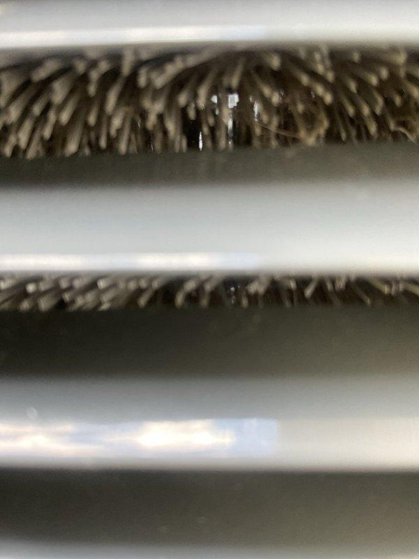 Completed non-member AC tune-up on a 5+ year old Trane residential air conditioning system. Performed comprehensive maintenance inspection including evaluation of outdoor condensing unit and indoor evaporator coil assembly. Evaporator coils showed significant accumulation of dirt and debris on fins, indicating need for cleaning to maintain optimal heat transfer efficiency. Outdoor unit positioned on concrete pad appeared in good overall condition with no visible damage or deterioration. Discussed air filtration options with homeowner to address system performance and indoor air quality concerns. System operational upon completion of tune-up service.