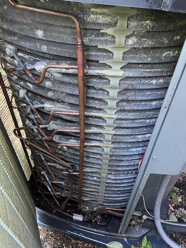 Completed comprehensive BFMA tune-up service on residential air conditioning system approximately 9 months old. Performed full system inspection including condenser coil cleaning to remove accumulated dirt and debris from exterior unit fins, checked refrigerant lines and connections for proper operation, replaced air filter, and verified all components functioning within manufacturer specifications. Unit tested and left in optimal operating condition.