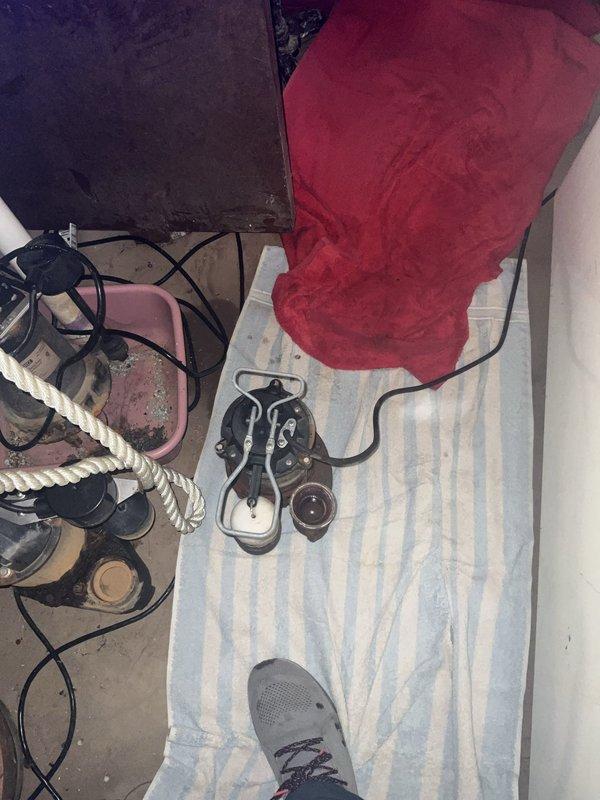 Responded to service call for non-operational sump pump system. Upon arrival, inspected sump pump assembly and discharge piping. Identified failed pump mechanism preventing water evacuation from sump basin. Replaced defective sump pump unit with new equipment, ensuring proper float switch operation and electrical connections. Repaired and reinforced discharge line using rubber couplings with stainless steel hose clamps to ensure secure, leak-free connection. Verified proper pump cycling, water discharge flow, and check valve function. System tested and confirmed operational with water successfully pumping from basin through exterior discharge line.