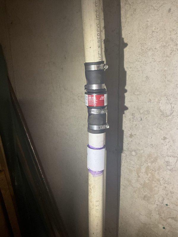 Responded to service call for non-operational sump pump system. Upon arrival, inspected sump pump assembly and discharge piping. Identified failed pump mechanism preventing water evacuation from sump basin. Replaced defective sump pump unit with new equipment, ensuring proper float switch operation and electrical connections. Repaired and reinforced discharge line using rubber couplings with stainless steel hose clamps to ensure secure, leak-free connection. Verified proper pump cycling, water discharge flow, and check valve function. System tested and confirmed operational with water successfully pumping from basin through exterior discharge line.