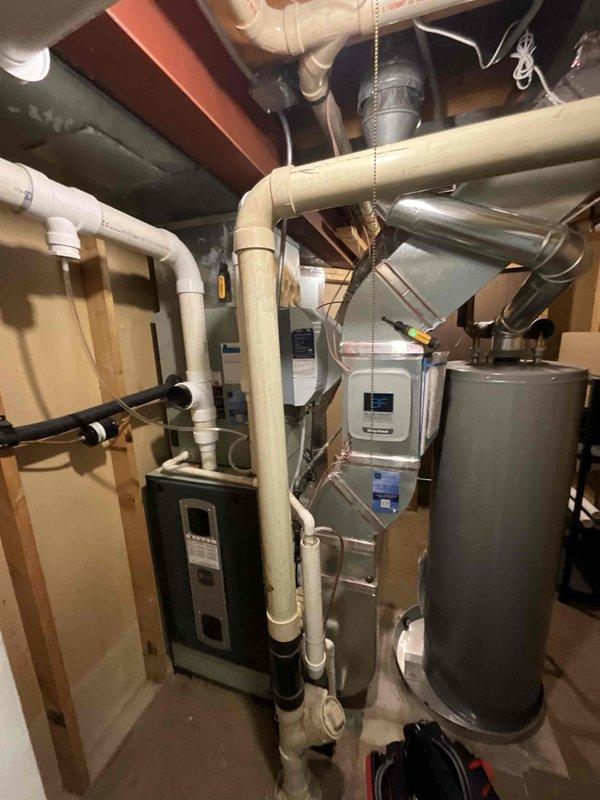 Completed comprehensive BFMA tune-up on residential HVAC system with equipment over 5 years old. Performed full inspection and maintenance of outdoor air conditioning unit including condenser coil cleaning, refrigerant pressure check, electrical connection testing, and capacitor evaluation. Inspected indoor furnace system in basement mechanical room, verified proper airflow through ductwork, examined heat exchanger, tested thermostat operation, and ensured all safety controls functioning correctly. System operating within manufacturer specifications upon completion, with all components cleaned, lubricated, and adjusted for optimal performance.