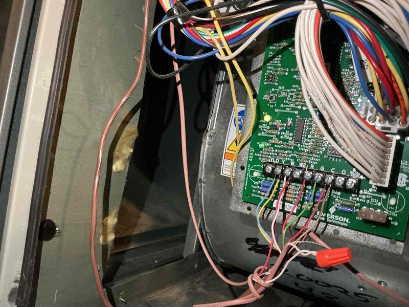 Completed comprehensive BFMA tune-up service on residential air conditioning system over 3 years old. Performed standard maintenance protocol including inspection of Emerson control board and wiring connections, verified proper operation of Honeywell digital thermostat displaying 72°F ambient with cooling setpoint at 67°F, and documented system components through photographic records. All electrical connections, control circuits, and thermostat functions tested and confirmed operational with system running in cooling mode.