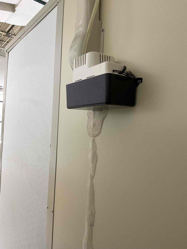 Responded to service call for commercial mini split system blowing hot air instead of cooling. Inspected both mini split units on property and identified malfunctioning system. Evaluated condensate pump assembly and drainage system, verified electrical connections at breaker panel, and documented existing equipment configuration. Communicated findings and repair recommendations to property contact for approval before proceeding with necessary repairs.