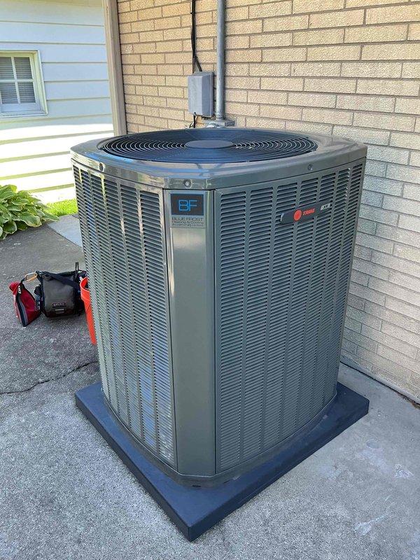 Completed comprehensive BFMA tune-up service on a 5+ year old Blue Frontier/Trane outdoor condensing unit. Upon inspection, discovered evaporator coils heavily clogged with dust, dirt, and debris accumulation that was significantly restricting airflow and reducing system efficiency. Thoroughly cleaned and cleared all coil fins, removed embedded debris, and restored proper airflow through the heat exchange surfaces to optimize cooling performance and prevent premature system failure.