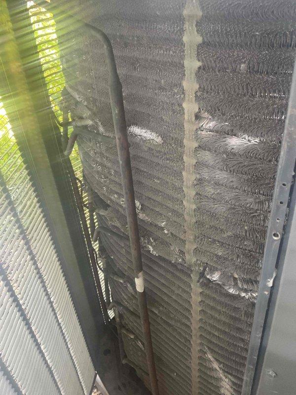 Completed comprehensive air conditioning tune-up on a unit over 5 years old. Performed full system inspection including condenser coil examination, which revealed moderate dust and debris accumulation between fins requiring attention. Inspected and evaluated air filter, noting significant dirt buildup on pleated media. Conducted standard maintenance procedures including temperature differential readings, refrigerant level check, electrical component testing, and airflow assessment to ensure optimal system performance for the cooling season.