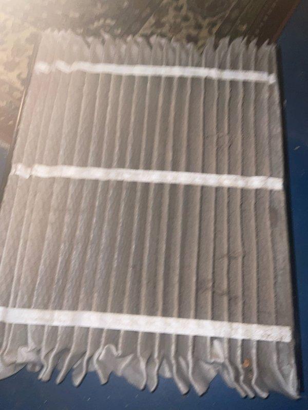 Completed comprehensive air conditioning tune-up on a unit over 5 years old. Performed full system inspection including condenser coil examination, which revealed moderate dust and debris accumulation between fins requiring attention. Inspected and evaluated air filter, noting significant dirt buildup on pleated media. Conducted standard maintenance procedures including temperature differential readings, refrigerant level check, electrical component testing, and airflow assessment to ensure optimal system performance for the cooling season.
