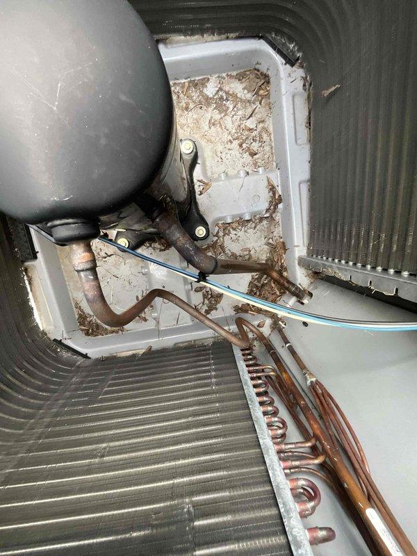 # HVAC Maintenance Summary

Completed comprehensive BFMA tune-up service on a 2-year-old Carrier air conditioning system, including AC performance evaluation, air filter replacement, and semi-annual electronic air cleaner (EAC) maintenance. 

# Detailed Work Performed

**Air Handler Inspection and Maintenance:**
Accessed interior air handler unit and performed thorough visual inspection of all accessible components. Observed significant corrosion and oxidation on copper refrigerant lines despite the relatively young age of the equipment, indicating potential moisture intrusion or environmental factors accelerating deterioration. Removed accumulated debris, dust, and organic matter from the air handler cabinet base to prevent airflow restrictions and maintain proper system hygiene. Inspected evaporator coil fins, which appeared in satisfactory condition with adequate spacing for proper heat exchange. Verified all electrical connections were secure, including low-voltage wiring. Noted th