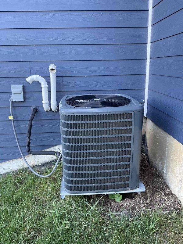 Completed comprehensive BFMA tune-up service on a Goodman HVAC system over 2 years old, including both indoor furnace unit located in basement mechanical room and outdoor cylindrical air conditioning condenser. Performed standard maintenance procedures on both components, inspected all connections, PVC condensate lines, ductwork, and verified proper system operation to ensure optimal performance for the upcoming cooling season.