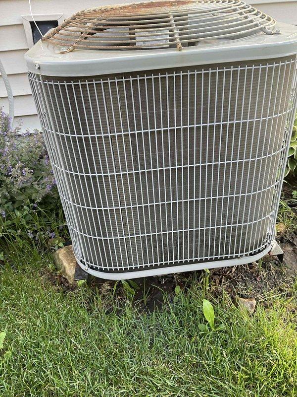 Completed comprehensive BFMA tune-up service on a 6+ year old outdoor air conditioning system. Performed full system inspection of the condenser unit, including examination of the heat exchanger coils which showed moderate dust accumulation and minor fin compression. Cleaned and evaluated all accessible components, verified proper operation of the fan assembly and protective grille system, and ensured unit was functioning within manufacturer specifications.