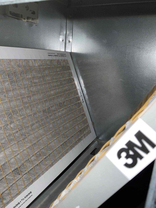 Completed comprehensive BFMA tune-up on residential air conditioning system, including inspection of outdoor condenser unit and indoor air handling components. Evaluated 8-year-old equipment for operational efficiency, verified proper airflow through system, and assessed air filter condition within the air handler. Condenser unit showed good operating condition with no visible damage, proper clearance from landscaping, and adequate ventilation through side slats and top fan guard.