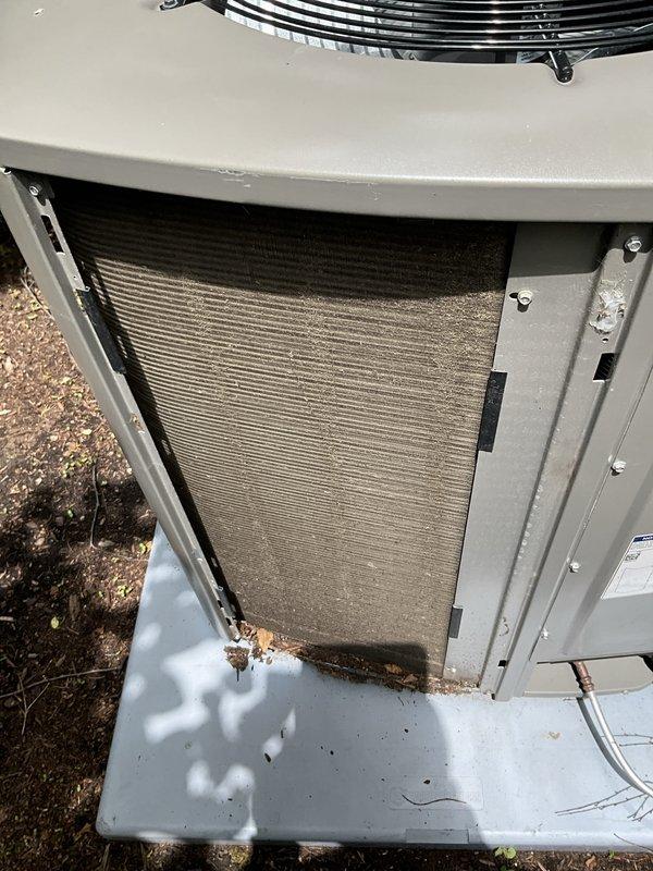 Completed comprehensive BFMA tune-up service on residential air conditioning system. Performed thorough inspection of outdoor condensing unit, accessed internal components through service panel, and evaluated condenser coil condition which showed moderate dust and debris accumulation on aluminum fins. Verified proper installation on concrete pad, inspected refrigerant line connections, confirmed fan guard integrity, and documented equipment condition with photographic records for maintenance history.