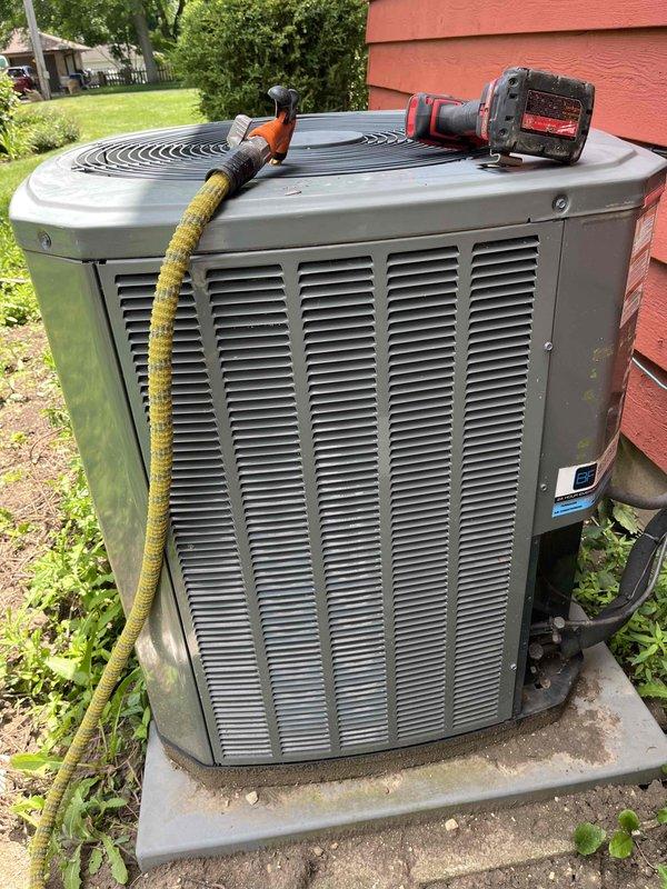 Completed comprehensive BFMA tune-up service on 9+ year old residential air conditioning system during afternoon appointment window. Performed standard maintenance protocol on outdoor condenser unit including inspection of all mechanical components, refrigerant lines, and electrical connections. Evaluated indoor evaporator coil assembly and noted dust and debris accumulation on finned surfaces, which was documented for future maintenance planning. All system components inspected, unit operating within normal parameters upon service completion.