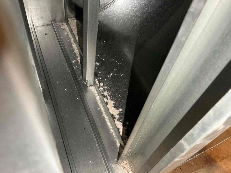 Completed comprehensive BFMA tune-up on Lennox HVAC system serving main house zone. Performed standard maintenance protocol including inspection of thermostat operation, verified system settings with heating setpoint at 62°F and cooling setpoint at 66°F, confirmed Away mode functionality. Inspected interior cabinet components and noted debris accumulation in bottom corner of unit housing, which is typical for equipment age 1+ years. System operating within normal parameters at time of service.