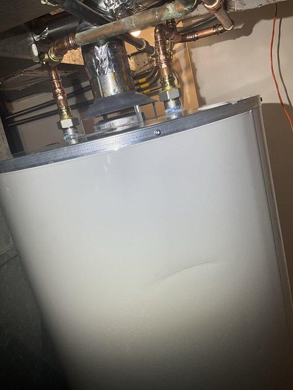 Responded to residential service call for tanked water heater with non-functioning pilot light. Upon arrival, performed diagnostic inspection of 6-year-old gas water heater unit. Examined thermocouple, gas control valve, and pilot assembly for proper operation. Inspected copper supply lines, pressure relief valve, and all plumbing connections for integrity and compliance. Verified gas supply line operation and cleared any obstructions from pilot orifice. Successfully relit pilot light and confirmed stable flame and proper thermocouple function. Tested burner ignition sequence and verified water heater returned to normal heating operation. All connections and safety devices confirmed operational before completing service.