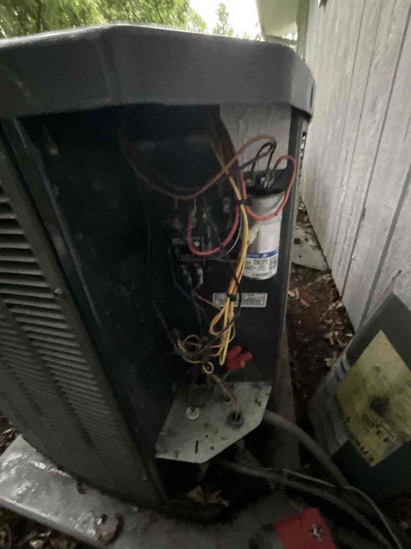 Completed comprehensive BFMA tune-up service on 5+ year old outdoor AC unit, including full system inspection, filter replacement, and performance verification. Accessed refrigerant lines through service panel, inspected copper tubing connections with color-coded insulation, verified electrical connections, and checked all mechanical components for proper operation. Unit operating within normal parameters with no issues identified at time of service.