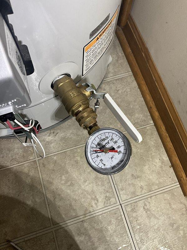 Completed comprehensive plumbing inspection and tune-up maintenance service at residential property. Inspected water heater assembly including pressure relief valve, temperature and pressure gauge reading within normal operating range (0-160 psi scale), brass valve connections, and copper supply line configuration. All plumbing components, fittings, and connections examined and found to be in proper working condition with no visible leaks, corrosion, or safety concerns identified. Documentation photos captured for service records.