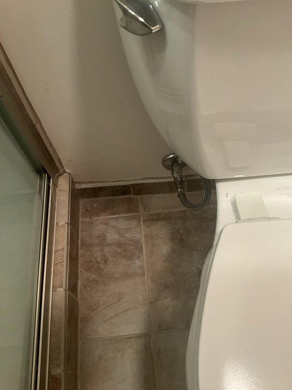 Completed comprehensive plumbing inspection as part of maintenance tune-up service, scheduled for afternoon arrival per customer request. Inspected interior plumbing system including copper supply lines with brass shut-off valve and red handle control mechanism in wall cavity, verified proper operation and checked for leaks. Examined bathroom plumbing fixtures including toilet, shower valve assembly, and associated water supply connections to ensure all components functioning properly with no visible issues detected.
