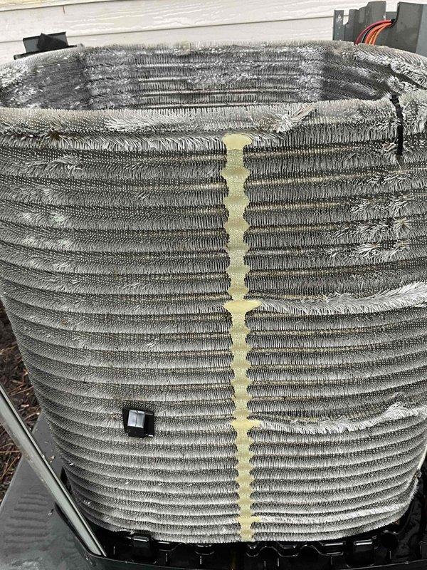 Completed comprehensive BFMA tune-up service on 3+ year old AC system. Upon arrival, found both outdoor condenser coil and indoor evaporator coil heavily contaminated with dust, dirt, and debris accumulation, significantly restricting airflow and reducing system efficiency. Thoroughly cleaned evaporator coil fins which showed dense lint-like material buildup and grayish matted appearance throughout the barrel assembly. Cleaned outdoor condenser coil which displayed visible dirt streaking and weathering between aluminum fins. Replaced air filter to restore proper airflow. Inspected electrical connections, wiring, and control components. Verified system operation and ensured unit is running at optimal performance levels following cleaning and maintenance procedures.