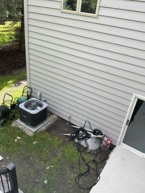 Conducted site evaluation for ductless mini-split system installation in sunroom area, assessing electrical infrastructure and exterior placement requirements for 9,000-12,000 BTU Daikin system. Inspected existing electrical panel with adequate breaker capacity and documented current outdoor condenser location to determine optimal positioning for new ductless unit. Provided estimate for Daikin ductless heat pump system with indoor wall-mounted air handler and outdoor condensing unit, including electrical connection requirements and refrigerant line set installation.