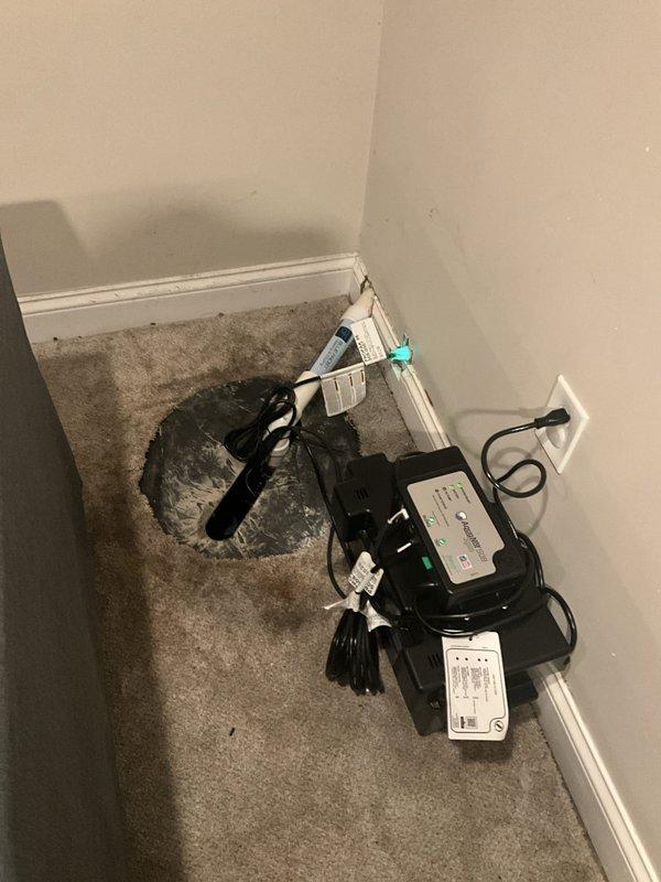 Removed existing sump pump system and installed new primary sump pump unit with backup battery system to ensure continued operation during power outages. Installed and configured battery backup controller with proper electrical connections, verified all power supplies and charging systems are functioning correctly, and tested system operation to confirm proper pump activation and battery engagement during simulated power loss conditions.