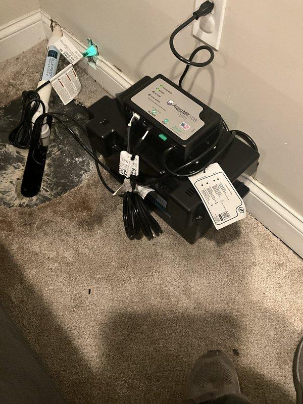 Removed existing sump pump system and installed new primary sump pump unit with backup battery system to ensure continued operation during power outages. Installed and configured battery backup controller with proper electrical connections, verified all power supplies and charging systems are functioning correctly, and tested system operation to confirm proper pump activation and battery engagement during simulated power loss conditions.