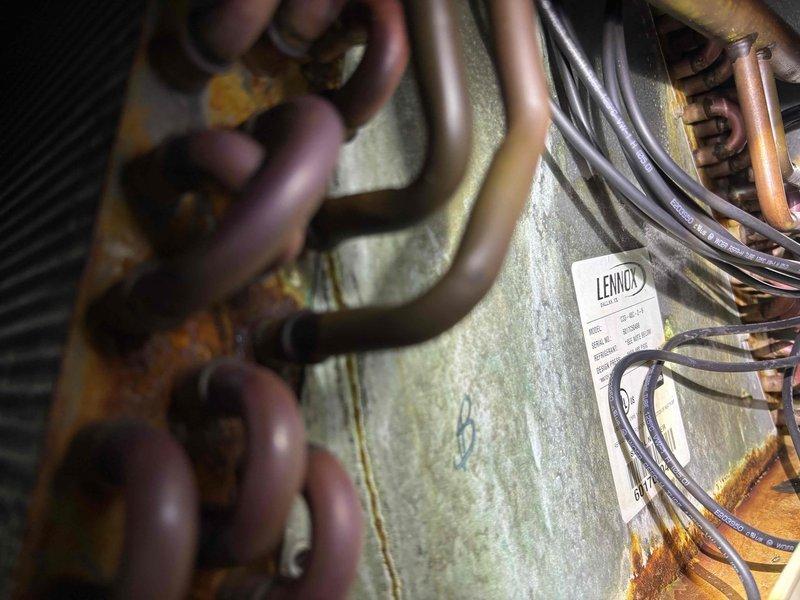Returned to residential property to perform UV dye leak search on HVAC system as recommended during previous service visit two weeks prior. Inspected Lennox air handler evaporator coil assembly and refrigerant lines using UV light throughout system including accessible ductwork and mechanical components. No fluorescent dye traces detected at evaporator coil, refrigerant line connections, or associated copper tubing, indicating no active refrigerant leaks present at time of inspection.