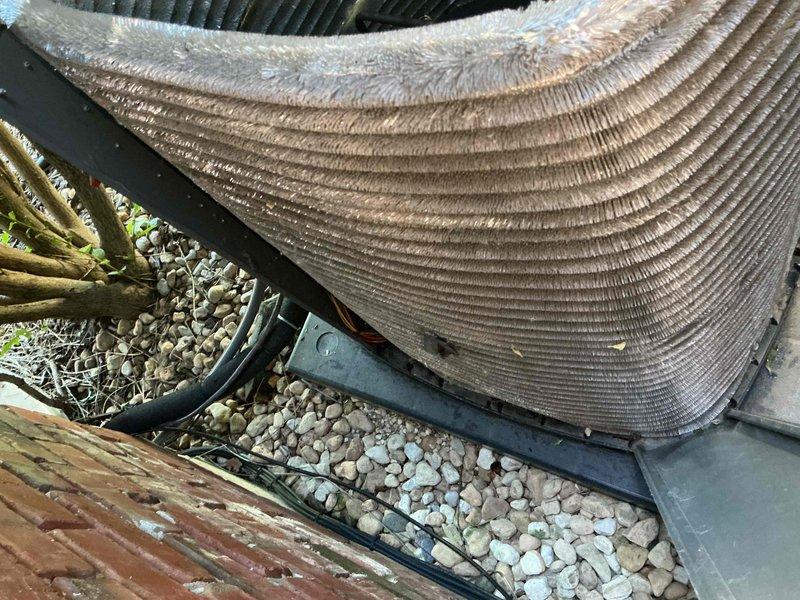 Completed comprehensive BFMA tune-up on residential air conditioning system with 4+ year old equipment. Inspected outdoor condenser unit, noting dirt and debris accumulation on coil fins requiring attention, and verified refrigerant line connections. Inspected indoor mechanical components including water heater assembly with visible mineral deposit buildup on mounting surfaces, checked electrical connections and control panel functionality, and documented equipment condition with photos for maintenance records.