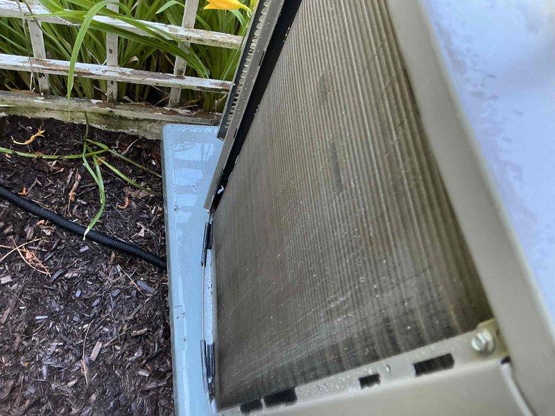 Completed comprehensive BFMA tune-up on one-year-old air conditioning system per membership agreement. Customer reported thermostat set to 70 degrees but indoor temperature remaining at 77 degrees, indicating insufficient cooling capacity. Performed standard maintenance protocol including inspection of outdoor condenser unit, verified refrigerant levels, checked electrical connections, cleaned condenser coils, and assessed airflow at indoor air handler located in basement utility area. Identified and addressed performance issue preventing system from reaching desired temperature setpoint. System tested and verified operational upon completion of tune-up service.
