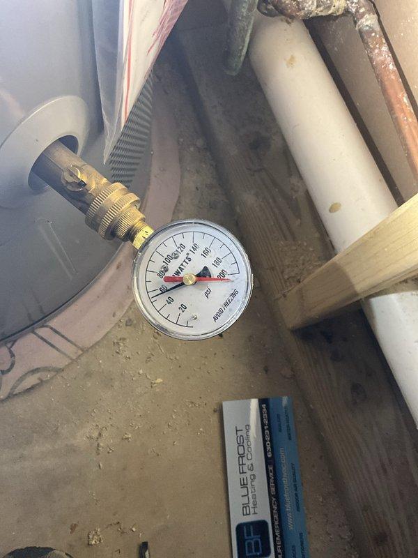 Completed comprehensive plumbing inspection of residential water heater system and associated piping infrastructure. Inspection included evaluation of Richmond water heater unit, copper supply and discharge lines, PVC drainage system, pressure relief valve operation, and all visible plumbing connections. HVAC system inspection was also performed during this service visit, with pressure testing conducted on refrigeration lines as evidenced by gauge readings on brass valve fittings.