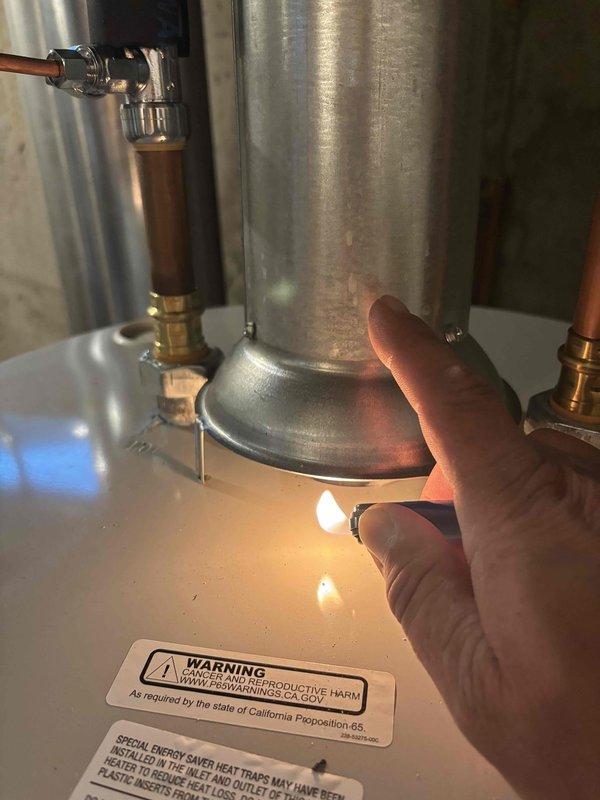 Responded to service call regarding recently installed water heater with excessive heat buildup in overhead piping. Upon inspection, identified cooling fan installed with incorrect orientation, directing airflow away from hot water pipes rather than providing adequate cooling. Verified water heater operation and pilot light function. Confirmed all copper supply lines, brass valves, and connections properly installed per code. Repositioned cooling fan to correct direction to properly ventilate hot water distribution piping and prevent excessive heat accumulation in confined basement mechanical space. Tested system operation to ensure adequate air circulation around piping. All components functioning as designed following fan repositioning.