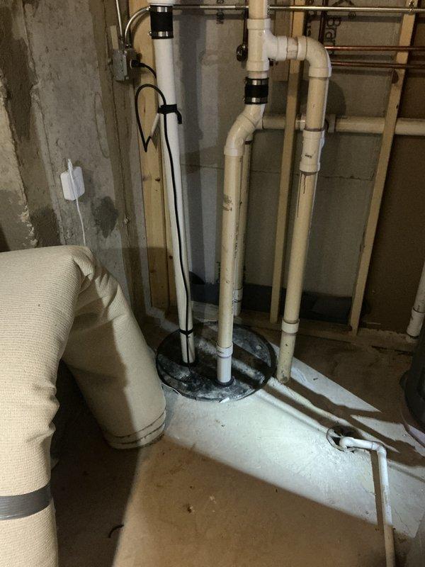 Completed comprehensive BFMA tune-up service on 11+ year old air conditioning system. Performed standard AC maintenance protocol including system inspection, filter evaluation, and condensate drain pan assessment. Documented existing plumbing infrastructure in utility area showing water heater installation with PVC drainage systems and HVAC ductwork integration. Inspected exterior condensate drain pan revealing moderate wear, rust staining, and drainage channel functionality. System operational upon completion with all components functioning within normal parameters.