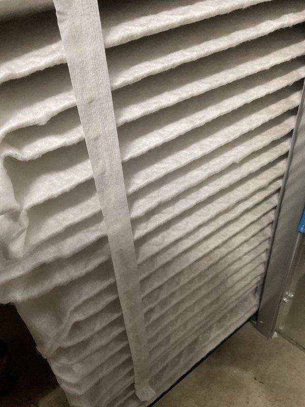 Completed comprehensive BFMA tune-up on residential air conditioning system with equipment age of one year. Performed standard maintenance protocol including inspection of outdoor condenser unit, verified proper refrigerant operation with visible frost accumulation on coil assembly indicating active cooling cycle, and replaced indoor air filter with new pleated media filter. All components inspected and found operating within normal parameters, system left in proper working condition.