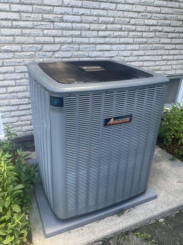 Performed comprehensive BFMA tune-up on Amana air conditioning system with equipment age of 4+ years. Inspected outdoor condensing unit, verified proper operation of all components, and documented existing air filter condition showing dust accumulation within pleated media. All system functions tested and confirmed operational per manufacturer specifications.