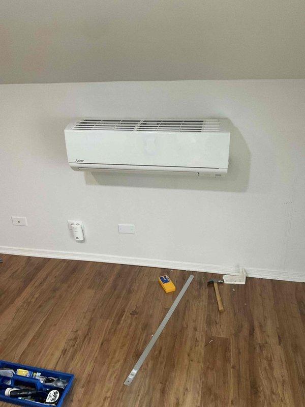 Responded to service call for reported heat pump leak in attic. Upon inspection, found Mitsubishi ductless mini-split system operating normally with no refrigerant leaks detected, no water leaks present, and no visible deficiencies noted. Unit functioning properly at time of service with all components operating within normal parameters. No trouble found during thorough inspection of indoor unit and surrounding area.