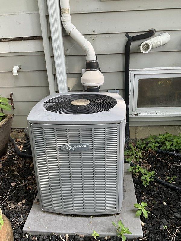 Completed comprehensive BFMA tune-up service on 12+ year old Armstrong air conditioning system. Performed standard maintenance procedures including inspection of outdoor condenser unit, verification of refrigerant levels, electrical component testing, and condenser coil cleaning. Inspected and documented condition of dual pleated air filters showing dust accumulation; filters appear serviceable but approaching replacement interval. Verified proper condensate drain line operation, checked fan motor operation, and ensured all safety controls functioning correctly. System operating within normal parameters upon completion of tune-up service.