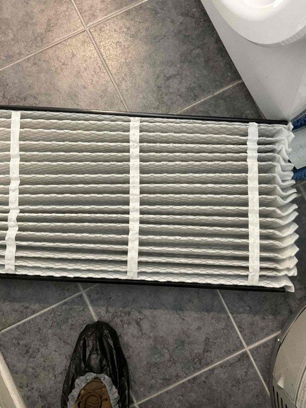 Completed comprehensive BFMA tune-up on a 5-month-old air conditioning system. Performed inspection of outdoor condenser unit, noting significant accumulation of dirt, dust, pollen, and organic debris on coil surfaces requiring cleaning to restore proper airflow and system efficiency. Replaced dirty air filter at indoor unit to improve air quality and system performance.