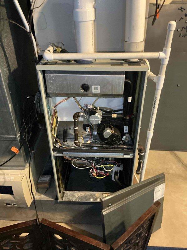 Conducted on-site evaluation of existing HVAC system following recent service call and subsequent equipment failure. Assessed furnace and air handler components, documented current system configuration including gas connections, electrical wiring, blower assembly, and ductwork arrangement. Photographed internal furnace components, condensate drainage system, and air handler installation to provide comprehensive estimate for complete air conditioning system and evaporator coil replacement.