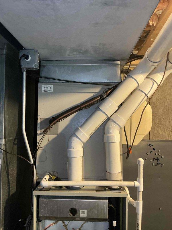Conducted on-site evaluation of existing HVAC system following recent service call and subsequent equipment failure. Assessed furnace and air handler components, documented current system configuration including gas connections, electrical wiring, blower assembly, and ductwork arrangement. Photographed internal furnace components, condensate drainage system, and air handler installation to provide comprehensive estimate for complete air conditioning system and evaporator coil replacement.