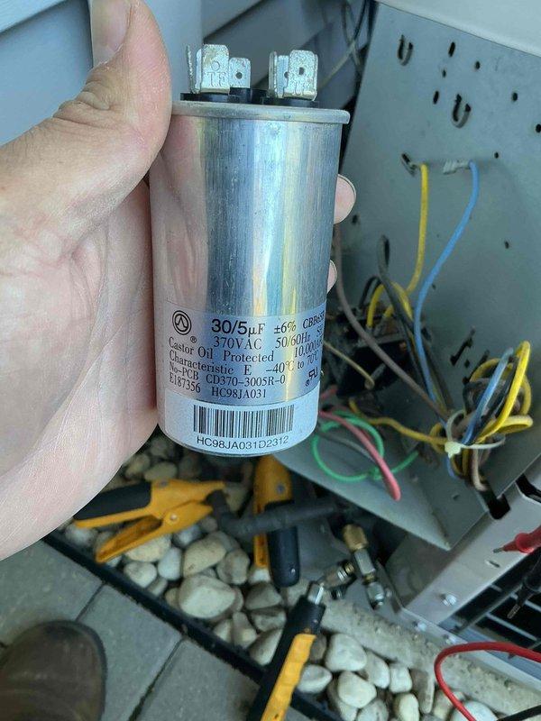 Completed comprehensive air conditioning tune-up on 13-year-old residential cooling system. Performed full system inspection including condenser unit evaluation, electrical component testing, and capacitor assessment. All components found operating within normal parameters, with dual-run capacitor (30/5 μF, 370VAC) confirmed in good working condition and system ready for cooling season.