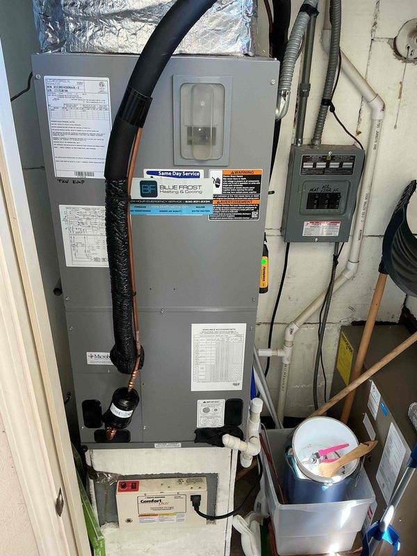 Completed comprehensive BFMA tune-up service on Blue Frost air handler unit located in utility closet. Performed full system inspection including electrical connections, condensate drain system with pump, ductwork connections, and all safety controls. Verified proper operation of all components, checked refrigerant levels, cleaned unit as needed, and confirmed system is operating within manufacturer specifications for optimal performance.