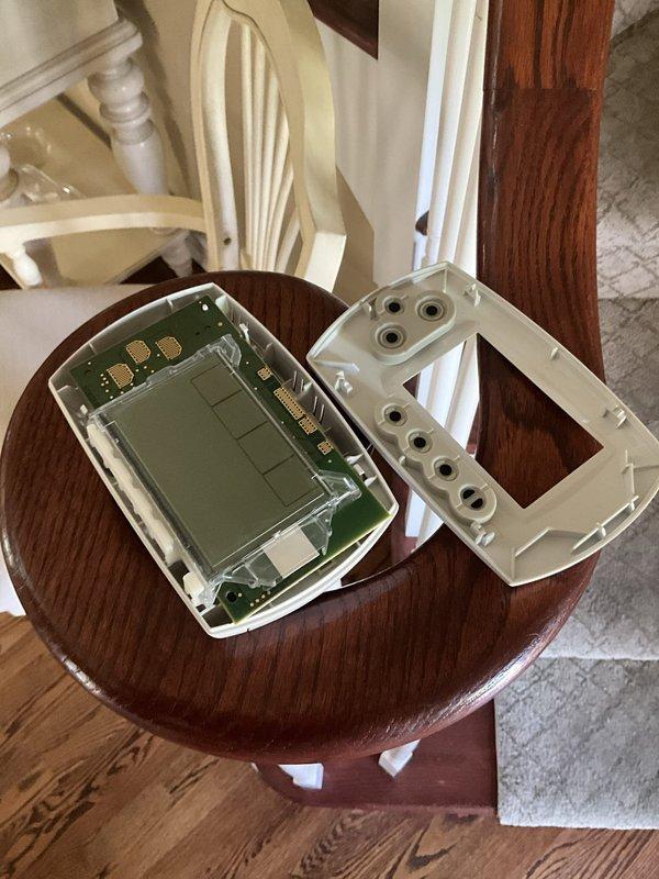Responded to no cooling complaint for upstairs zone. Upon inspection, found Honeywell THM5320R zoning thermostat disassembled due to physical damage reported by homeowner. Inspected circuit board and housing components; no operational faults found with HVAC system itself. Issue isolated to broken thermostat requiring replacement to restore upstairs zone control.